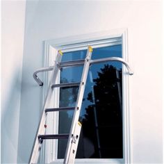 a ladder is attached to the side of a window