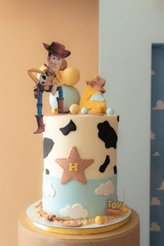 a toy story themed birthday cake on a table