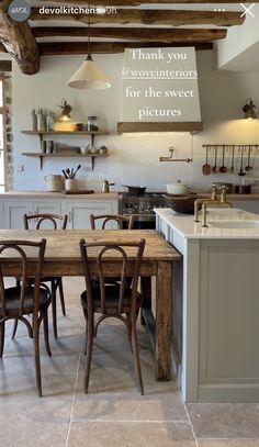 an image of a kitchen setting with table and chairs