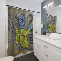 a bathroom with a painting on the shower curtain