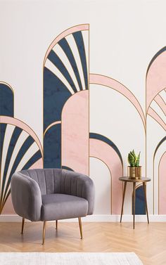 a chair and table in front of a wall with an art deco design on it