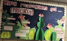 a bulletin board with paper cutouts and cactuses on it, which are labeled when relationships get tricky