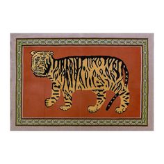 an animal rug with a tiger on it's side and a border in the middle