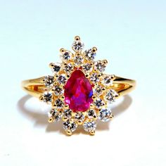 .60ct. Natural Ruby Cocktail Halo Ring Pear Cut Fully Faceted Clean Clarity 5.3 X 3.4mm Vivid Red / Vs Clear Clarity .42ct. Diamonds: Rounds, Full Cuts G-Color, Vs-2 Clarity. 14kt. Yellow Gold. 3.2 Grams. Deck Of Ring: 14mm X 11mm Depth: 6.3mm Current Ring Size: 5 We May Resize, Please Inquire. $5000 Appraisal Certificate Will Accompany. Teardrop Yellow Gold Ruby Ring For Wedding, Pear-shaped Gold Ruby Ring With Diamonds, Pear-shaped Ruby Diamond Ring In Gold, Pear-shaped Brilliant Cut Yellow Gold Ruby Ring, Gold Ruby Ring Pear-shaped, Gold Ruby Ring With Pear-shaped Gemstone, Yellow Gold Pear-shaped Ruby Ring With Center Stone, Gold Diamond Teardrop Ring With Halo Setting, Pear-shaped Yellow Gold Ruby Ring