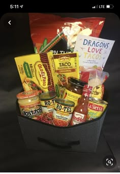 a basket filled with lots of food and condiments