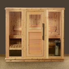 a wooden sauna with glass doors and shelves