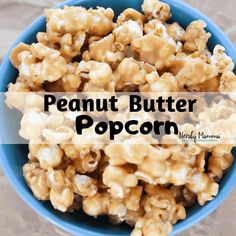 a blue bowl filled with caramel flavored peanuts and the words peanut butter popcorn