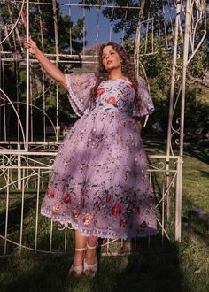 Lavender Haze And Summer DaysThis whimsical and enchanting piece captures the essence of springtime beauty. Its soft lavender hue is beautifully accented with vibrant floral embroidery, featuring bold red poppy blossoms, wildflowers, and delicate... Garden Tea Party Outfit, Fairy Green Dress, Bridgeton Theme, Whimsical Outfit, Spring Witch, Lavender Outfit, Spring Time Outfits, Garden Party Outfit, Hope Is The Thing With Feathers