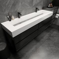 a modern bathroom with black and white fixtures