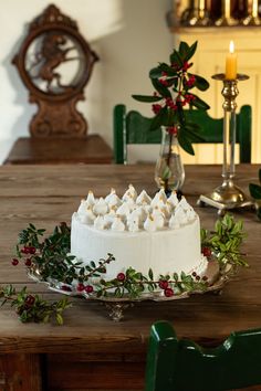 a white cake sitting on top of a wooden table