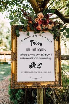 a welcome sign with flowers and greenery on it