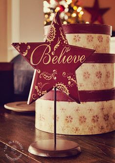 a red and white cake with a star on top