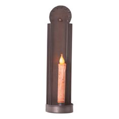 a candle that is on top of a metal holder with a light inside it and an orange flame in the middle