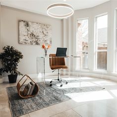 an office with a desk, chair and bookshelf in the middle of it