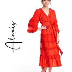 This Gorgeous Alexis X Target Midi Or Maxi Dress Features A Flowing Ruffled, Tiered Skirt With Romantic, Sheer, Swiss Dot Panels. The Wide, Open Sleeves Are In A Soft And Light Angel Style With Ruffles. It Features A Removable Fabric Belt And The Wrap Style Bust Has A Hidden Button To Be Worn In A More Demure Look. The Color Is A Unique Blood Orange Shade And Is Fully Lined Underneath. Elastic Stretch Waist. Sz.M Pit To Pit 17” Waist 13” Sleeve Length 20” Length 48.5” Can’t Pay Right Away? Split Alexis Dress, Orange Chiffon, Target Dress, Cream Lace Dress, Asymmetrical Hem Dress, Tiered Ruffle Dress, Ruffle Midi Dress, Floral Embroidered Dress, Hi Low Dresses