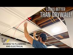 a man working on a ceiling with the words looks better than drywall