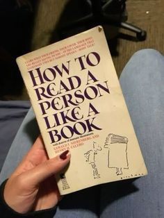 a person is holding up a book about how to read a person like a book