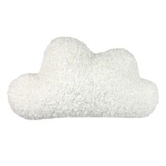 a white cloud shaped pillow sitting on top of a table