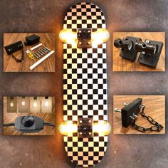 a skateboard with some lights on it sitting on a table next to other items