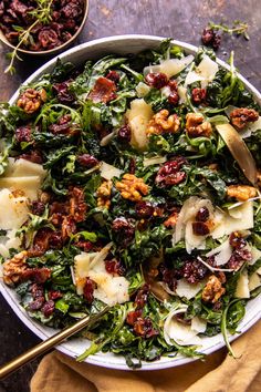 a white bowl filled with greens and meat