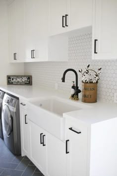 the kitchen is clean and ready to be used as a washer and dryer