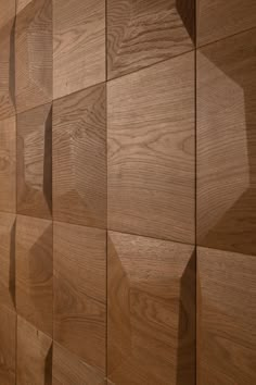 wood panels are arranged in the shape of hexagonal shapes on a wooden wall