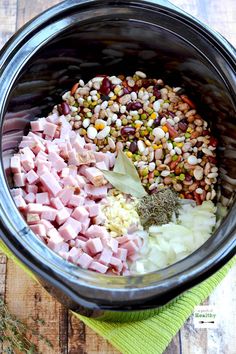 the ingredients in this slow cooker include ham, corn and spices to make an entree