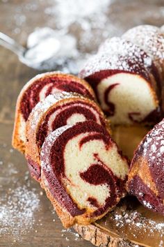 red velvet marble cake on a cutting board with powdered sugar