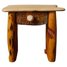 a small wooden table with two legs and a drawer on the top that is made out of wood