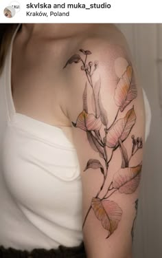 a woman with a flower tattoo on her arm