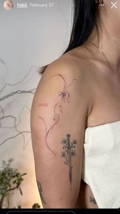 a woman with a tattoo on her arm