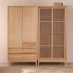 a large wooden cabinet sitting on top of a hard wood floor next to a wall