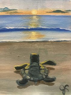 a painting of a turtle on the beach