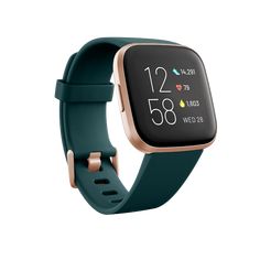 the fitbit smart watch is shown in teal and rose gold