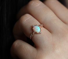 When we think of the land down under, we think of the sandy beaches and the lovely people, but one of the beautiful things that originate there are Australian opals. One of them is set in this beautiful Florence ring - featuring a high quality Australian opal gemstone, side diamonds and rose gold setting, this truly is a stunning vintage engagement ring.
Note: The design can be made with gemstones of your choosing.
Details
Center Stone


Gemstone: high quality genuine Australian opal with lots o White Opal Engagement Ring, Oval Opal Ring, Opal Engagement Ring Rose Gold, Opal Engagement Ring Set, Gold Opal Ring, Rose Gold Opal Ring, Diamond Ring Vintage, Gold Rings For Women, Opal Diamond Ring