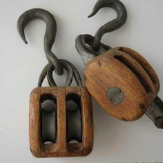 two pieces of wood with metal hooks attached to them