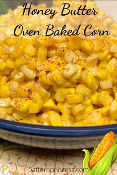 a blue bowl filled with corn on top of a table