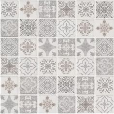 a gray and white tile wallpaper with different designs on it's sides, including an ornate design