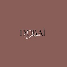 the word dobai written in black ink on a brown background