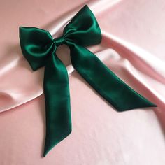 "Meet the super versatile Euphrasie hair bow, offering three in one hair ribbon styles. Detachable ribbon tails mean you can wear your bow on its own in our Lily hair bow style, with girlier bow tails or tie the bow tail onto a hair elastic (or even your scrunchie) for a simpler pony scarf style. If you only buy one hair accessory this year, make it our most multifunctional piece yet.  Adding the tails back to your hair bow is designed to be simple using a bobby pin to pull the silk back through Green Hair Ribbon, Victorian Reference, Hair Bow Style, Hair Bow Ribbon, Ribbon Barrettes, Subtle Balayage, Three In One, Bow Style, Hair Bobbles