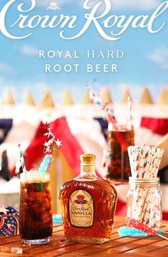 a bottle of royal hard root beer sitting on top of a wooden table