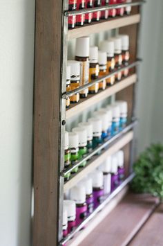 Essential Oil Display Shelf Constructed of Pine and Steel. Holds up to 32- 15ml bottles OR 36- 5ml bottles. Could also hold nail polish, trinkets, or spices! SIZE 12 x 16 1/2 inches See listing picture for specific measurement diagram. COLOR 5 stain color options available. Shown in Classic Grey. Please see the last picture for stain color options. HARDWARE Two keyholes are routed into the back for flush-mounted hanging. We recommend hanging with screws and drywall anchors, not included. SHIPPIN Shelf For Essential Oils, Essential Oil Storage Ideas, Essential Oil Display, Oil Display, Nail Polish Display, Oil Shelf, Essential Oil Shelf, Drywall Anchors, Polish Display