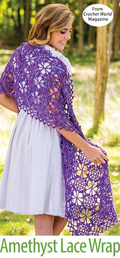 a woman standing in the woods wearing a purple crochet shawl and white dress