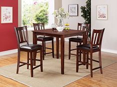 a dining room table and chairs with a rug on the floor in front of it