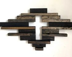 a cross made out of wooden planks on a wall