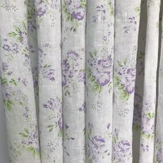 purple and green flowers on white curtains