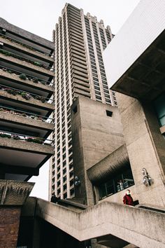 the tall building has many windows and balconies on it's sides,