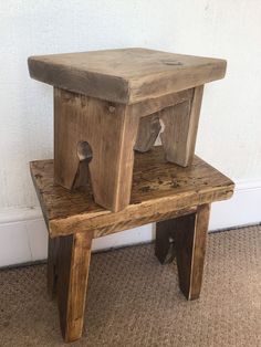 a wooden bench with two bells on it