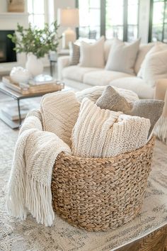 a living room filled with furniture and a large basket on top of a coffee table