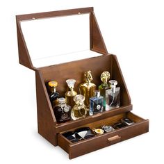 an open wooden box with various perfumes in it